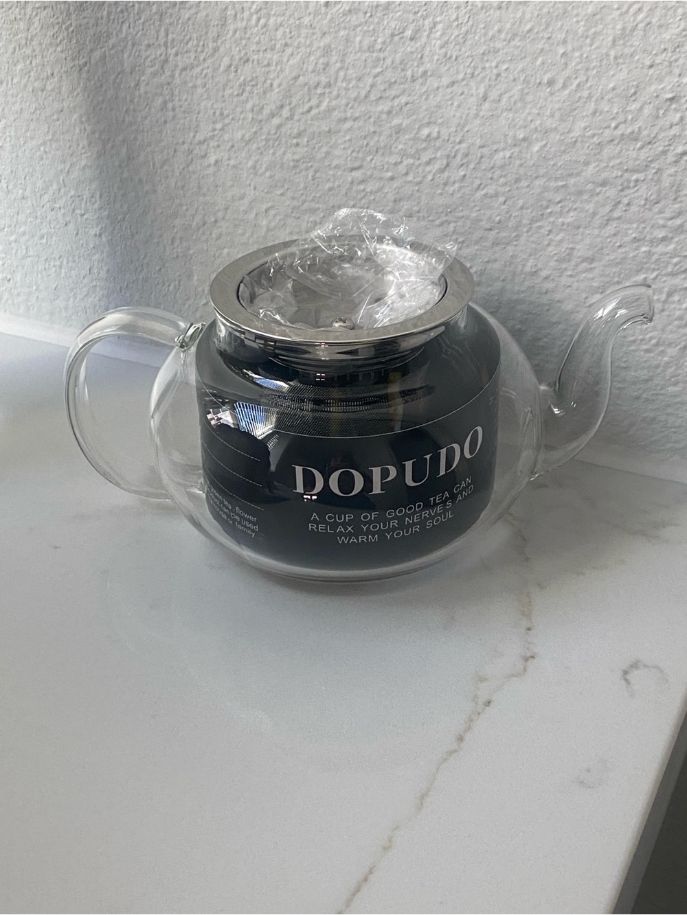 DOPUDO glass teapot with a stainless steel infuser.